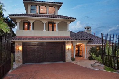Example of a tuscan exterior home design in Austin