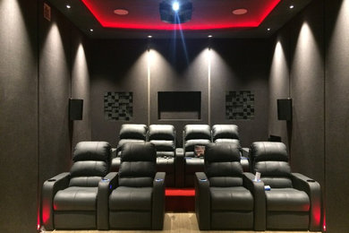 This is an example of a transitional home theatre in Delhi.
