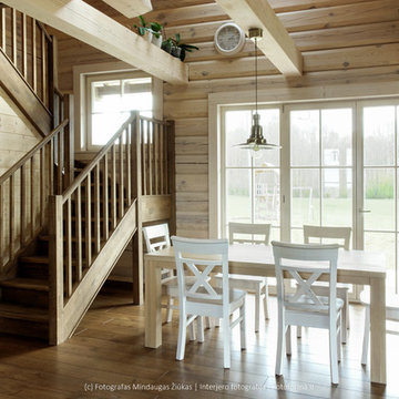 Photography of wooden stairs installed in a log house near Vilnius.