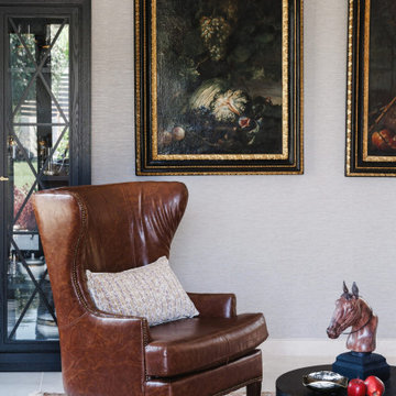 Neoclassical Living Room with Leather Wing Chair and Oil Paintings