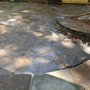 Large Irregular Bluestone Patio, Seating Wall, and Walkways Plus In Laid Design