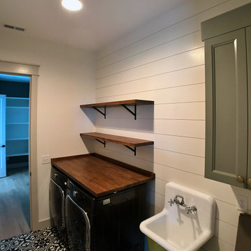 Modern Farmhouse Laundry Room with Shiplap Walls and Black White Patterned Tile