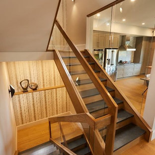 Mixed modern u-shaped staircase with slate treads and wood risers.