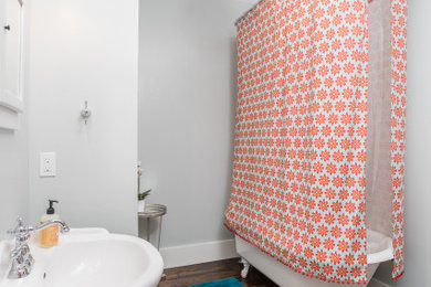 Inspiration for a small claw-foot bathtub remodel in Austin