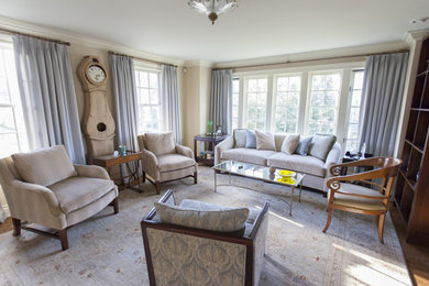Example of a transitional living room design in New York