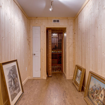 Secret passageway wine cellar. Basement layout with all mahogany racking.