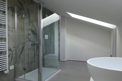 This is an example of a large contemporary master bathroom in Other with a wall-mount toilet, white walls and porcelain floors.