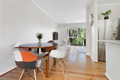This is an example of a contemporary dining room in Adelaide.