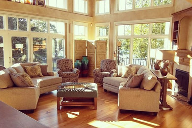 Large transitional formal and open concept light wood floor living room photo in Other with beige walls, a corner fireplace and a tile fireplace