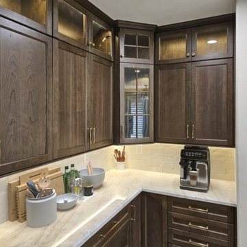 Warm Under-Cabinet Lighting with Cream Brick Tile Backsplash