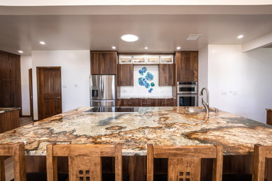 Inspiration for a large l-shaped vinyl floor and brown floor eat-in kitchen remodel in Albuquerque with an undermount sink, flat-panel cabinets, medium tone wood cabinets, granite countertops, white backsplash, ceramic backsplash, stainless steel appliances, an island and gray countertops