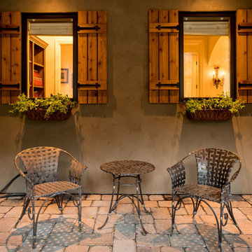 Elk Country Estate_French Country_Covered Patio Window Shutters and Flower Baske