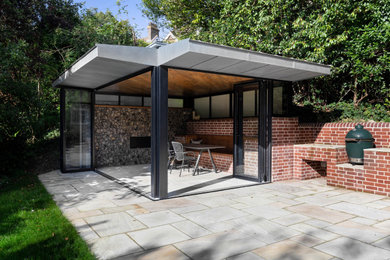 This is an example of a contemporary garden shed and building in Sussex.