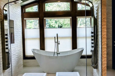 Inspiration for a mid-sized contemporary master white tile and porcelain tile porcelain tile and white floor bathroom remodel in Denver with flat-panel cabinets, dark wood cabinets, a one-piece toilet, beige walls, a drop-in sink and quartz countertops