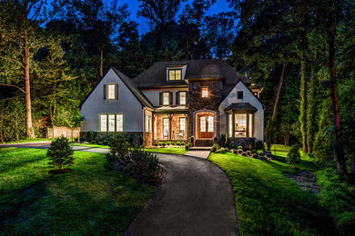 Inspiration for a large transitional beige three-story mixed siding exterior home remodel in DC Metro with a shingle roof