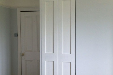 Medium sized classic bedroom in Edinburgh with light hardwood flooring.