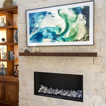 Sea Toned Contemporary Living Room with Striking Stone Firepalce