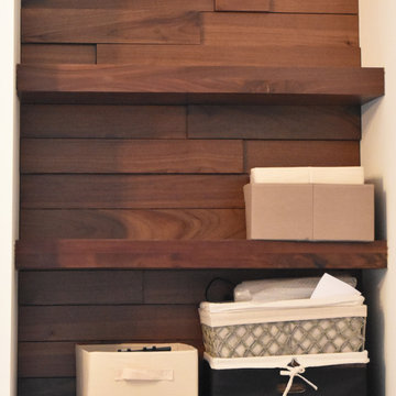 Staggered Walnut Wall with Floating Shelves