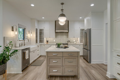 Inspiration for a mid-sized transitional u-shaped eat-in kitchen remodel in Other with recessed-panel cabinets, white cabinets, quartz countertops, an island and white countertops