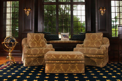 Example of a mid-sized classic formal and enclosed medium tone wood floor and brown floor living room design in Milwaukee with black walls, no fireplace and no tv