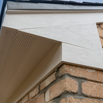 Brick Home Refresh with Hardie Siding, Fascia, Soffit, and Modern Column Replace