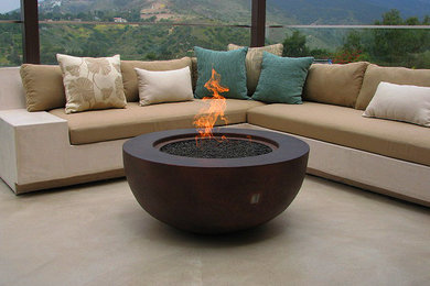 Inspiration for a large backyard patio remodel in Los Angeles with a fire pit and no cover
