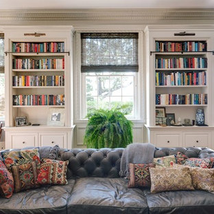 Example of a huge classic open concept medium tone wood floor family room design in Other with gray walls, a standard fireplace, a stone fireplace and a tv stand