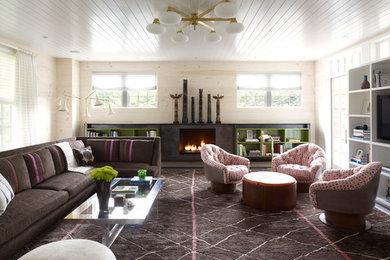 Living room - mid-sized contemporary enclosed living room idea in New York with beige walls and a media wall