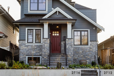 Mid-sized arts and crafts three-story concrete fiberboard exterior home photo in Vancouver with a shingle roof and a black roof