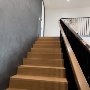 Open Staircase with Wood Treads and Dark Plaster Wall - Woodland Hills