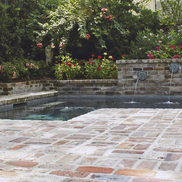 Pool, waterfall, and landscaping