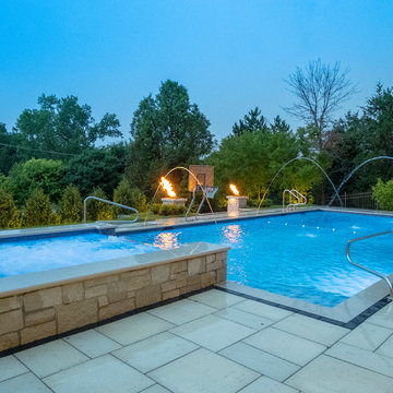 Burr Ridge Lap Pool with Raised Hot Tub and Waterfall
