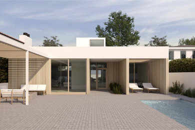 Example of a minimalist white one-story exterior home design in Los Angeles