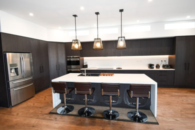 Design ideas for a mid-sized contemporary eat-in kitchen in Sydney with dark wood cabinets, white splashback, glass sheet splashback, stainless steel appliances and with island.