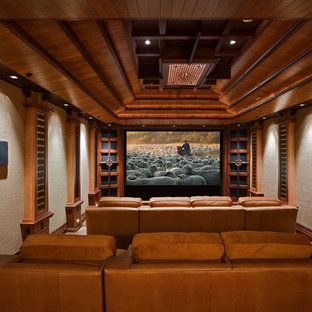 Home theater - large traditional enclosed home theater idea in Albuquerque with a projector screen