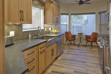 Photo of a mid-sized transitional galley eat-in kitchen in Phoenix with a farmhouse sink, raised-panel cabinets, light wood cabinets and beige floor.