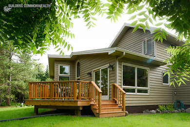 Inspiration for a transitional backyard patio remodel in Other with decking and no cover