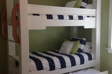 Example of a small classic boy carpeted kids' room design in Denver with green walls