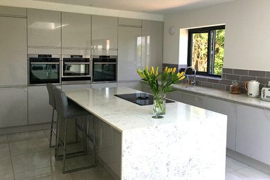 This is an example of a contemporary kitchen in Sussex.