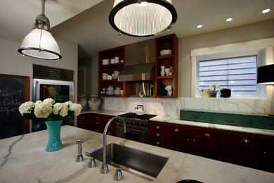Example of a mid-sized trendy l-shaped eat-in kitchen design in Chicago with an undermount sink, marble countertops, stainless steel appliances, dark wood cabinets, white backsplash, stone slab backsplash, flat-panel cabinets and an island
