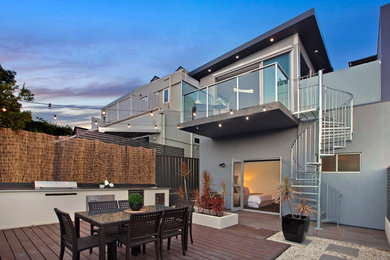 This is an example of a small contemporary backyard full sun garden in Sydney with decking.