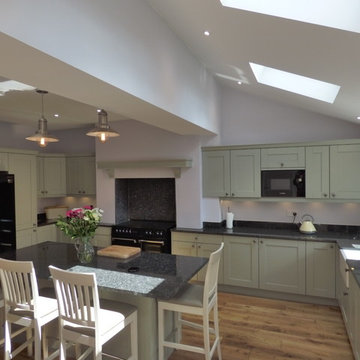 sage green painted shaker in large open plan kitchen