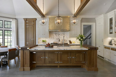 Example of a large galley gray floor and vaulted ceiling eat-in kitchen design in New York with an undermount sink, recessed-panel cabinets, medium tone wood cabinets, marble countertops, white backsplash, marble backsplash, stainless steel appliances, an island and white countertops