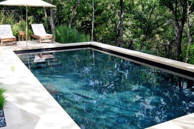 Inspiration for a contemporary concrete and rectangular pool remodel in Austin