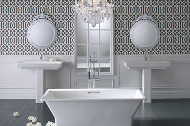 Inspiration for a large timeless master dark wood floor freestanding bathtub remodel in Boston with a pedestal sink and gray walls