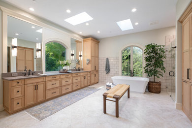 Example of a large classic master white tile and subway tile porcelain tile, beige floor and double-sink bathroom design in Portland with shaker cabinets, light wood cabinets, a one-piece toilet, white walls, a drop-in sink, quartz countertops, a hinged shower door, gray countertops and a built-in vanity