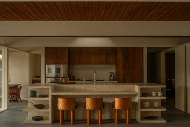 Example of a 1950s concrete floor and gray floor living room design in Los Angeles