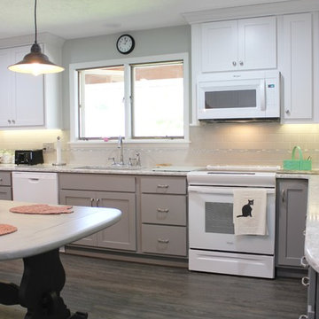 White Upper Cabinet and Gray Base Cabinet Kitchen With Quartz Counters