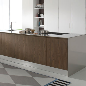 System Collection by Pedini. Lacquer back wall pantry with pocket doors and an E