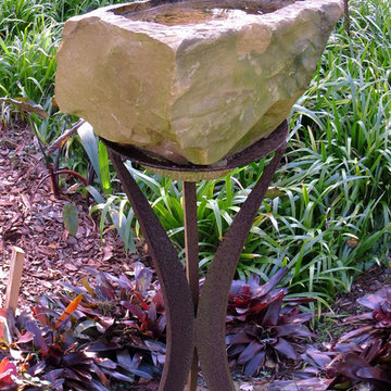 Metal and stone bird bath